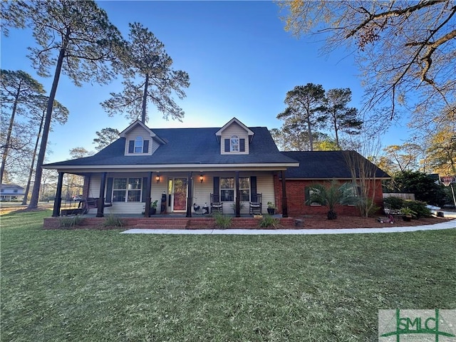 204 Archibald St, Rincon, GA 31326 - view of front facade featuring covered porch and a front yard