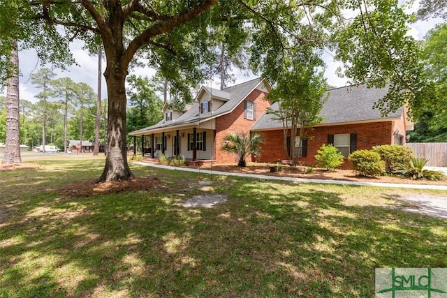 204 Archibald St, Rincon, GA 31326 - cape cod-style house with brick siding and a porch