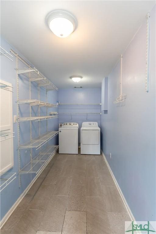 204 Archibald St, Rincon, GA 31326 - laundry area featuring washing machine and dryer and baseboards