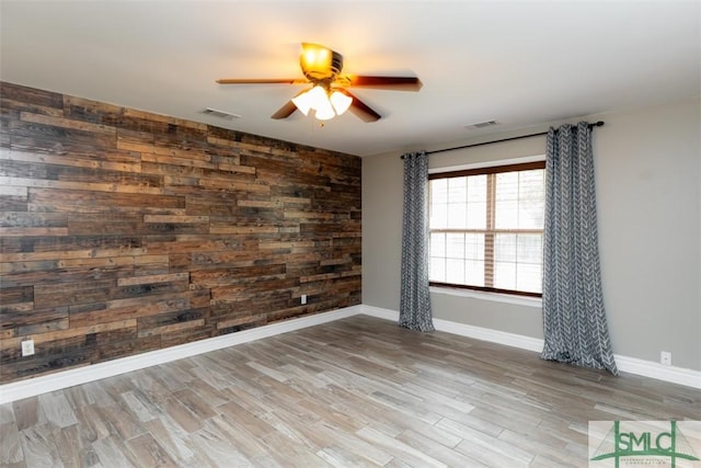 204 Archibald St, Rincon, GA 31326 - empty room with ceiling fan, wood finished floors, baseboards, and wood walls