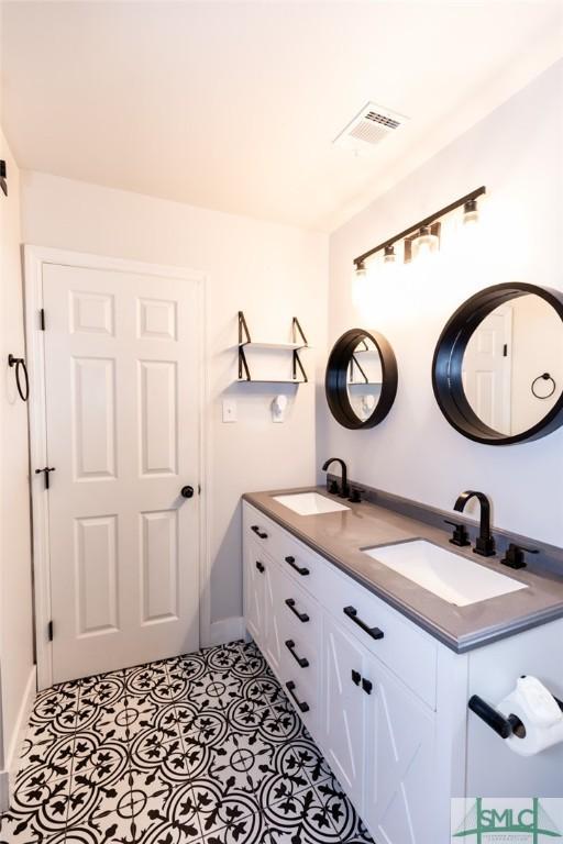 204 Archibald St, Rincon, GA 31326 - full bath featuring double vanity and baseboards