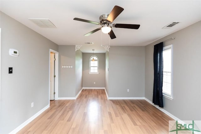204 Archibald St, Rincon, GA 31326 - empty room featuring ceiling fan, light wood finished floors, and baseboards