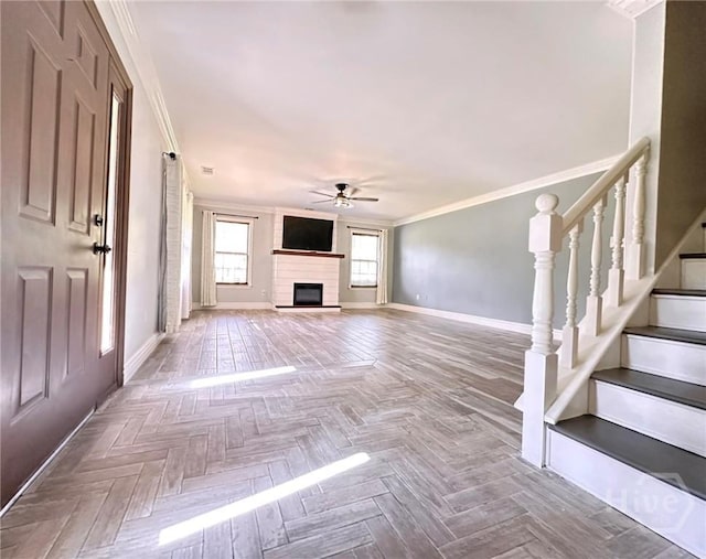 204 Archibald St, Rincon, GA 31326 - unfurnished living room with a ceiling fan, baseboards, crown molding, a large fireplace, and stairway