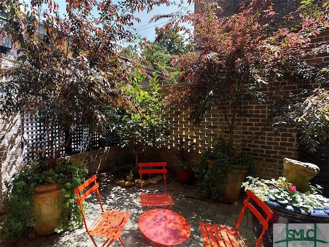view of patio / terrace featuring fence