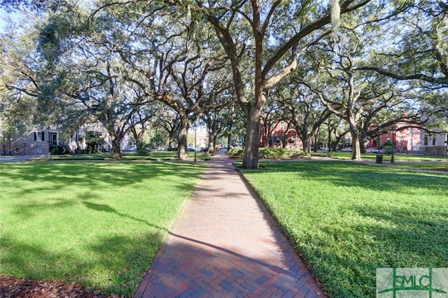 surrounding community featuring a lawn