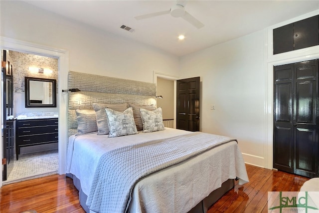 bedroom with visible vents, ceiling fan, and hardwood / wood-style floors