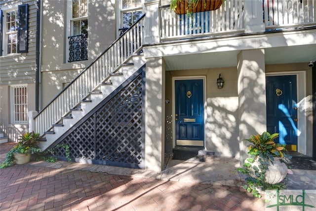 doorway to property featuring a balcony