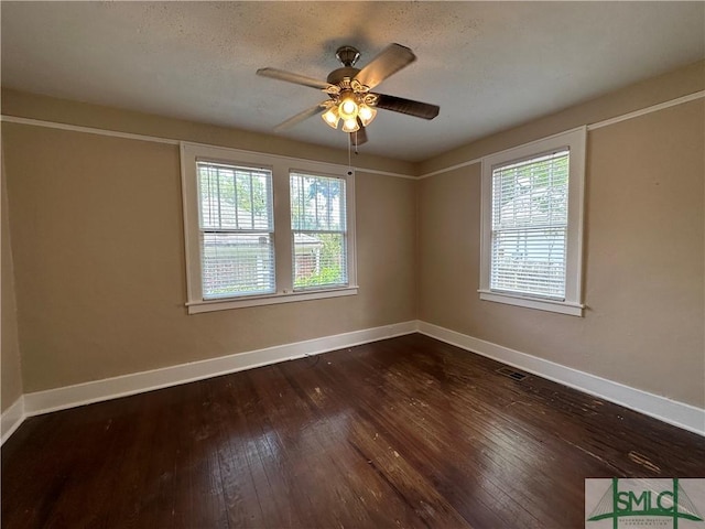 724 E 49th St, Savannah, GA 31405 - empty room featuring a ceiling fan, baseboards, dark wood finished floors, and visible vents