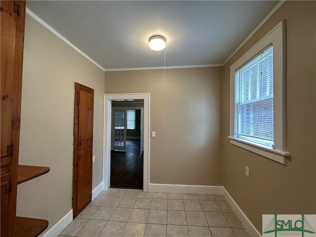 724 E 49th St, Savannah, GA 31405 - unfurnished dining area featuring crown molding, baseboards, and light tile patterned floors