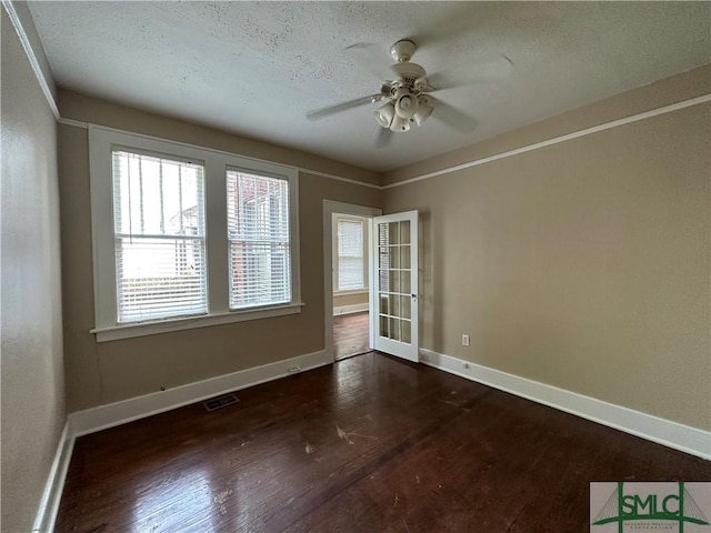 724 E 49th St, Savannah, GA 31405 - unfurnished room with baseboards, visible vents, and dark wood-type flooring