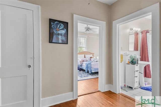 724 E 49th St, Savannah, GA 31405 - doorway featuring baseboards, a ceiling fan, and wood finished floors