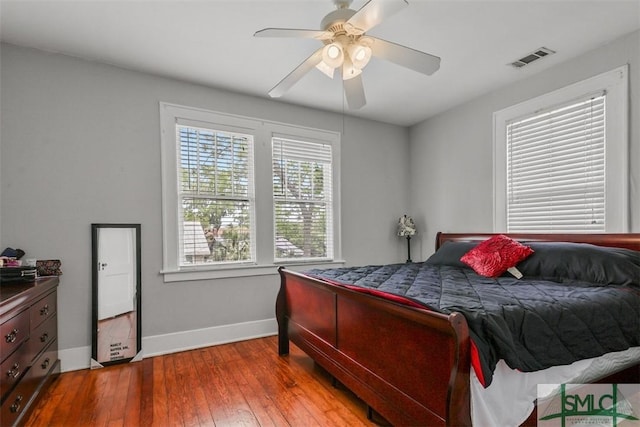 724 E 49th St, Savannah, GA 31405 - bedroom with visible vents, a ceiling fan, baseboards, and hardwood / wood-style flooring