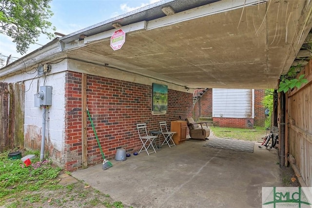 724 E 49th St, Savannah, GA 31405 - view of patio with fence and an attached carport