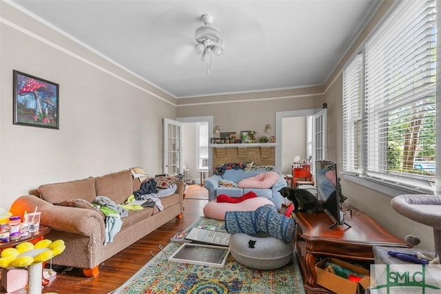 724 E 49th St, Savannah, GA 31405 - living area featuring crown molding, ceiling fan, and wood finished floors