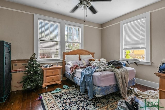 724 E 49th St, Savannah, GA 31405 - bedroom featuring wood-type flooring, a ceiling fan, baseboards, and multiple windows