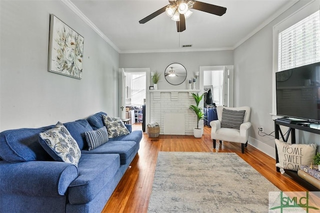 724 E 49th St, Savannah, GA 31405 - living area with plenty of natural light, ceiling fan, and wood finished floors