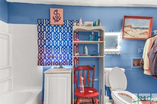 724 E 49th St, Savannah, GA 31405 - full bathroom featuring toilet, a sink, and a bath