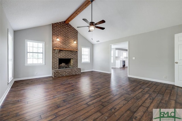 unfurnished living room with vaulted ceiling with beams, ceiling fan, baseboards, and dark wood-type flooring