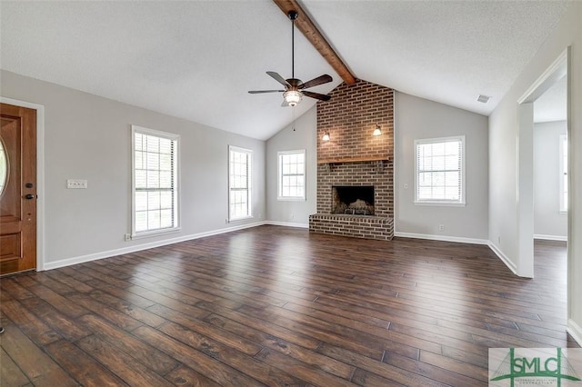 unfurnished living room featuring ceiling fan, lofted ceiling with beams, dark wood finished floors, and visible vents