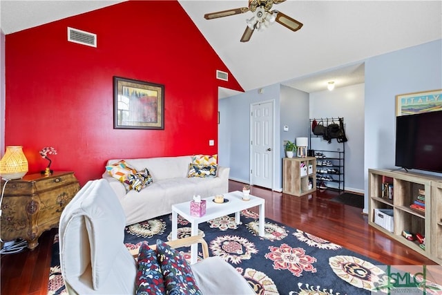 living room with wood finished floors, a ceiling fan, lofted ceiling, and visible vents
