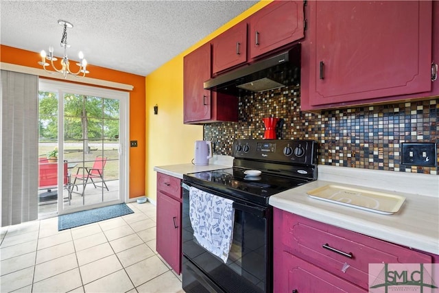 kitchen with light countertops, under cabinet range hood, electric range, and a notable chandelier