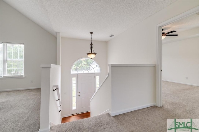 133 Ridgewood Cir, Rincon, GA 31326 - entrance foyer with carpet floors, a textured ceiling, visible vents, and baseboards