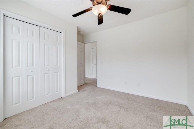 133 Ridgewood Cir, Rincon, GA 31326 - unfurnished bedroom with carpet floors, a ceiling fan, baseboards, and a closet