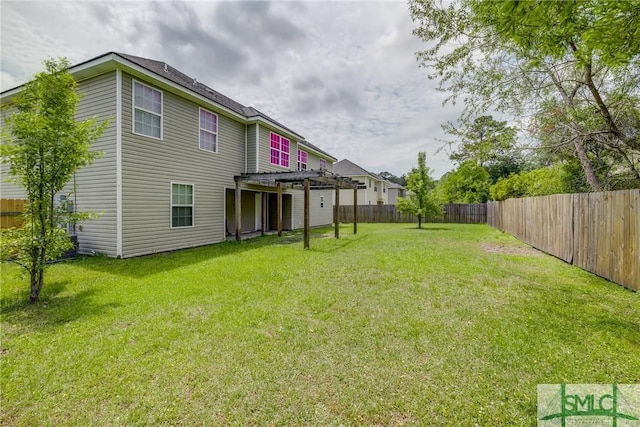 133 Ridgewood Cir, Rincon, GA 31326 - back of property featuring a lawn, a fenced backyard, and a pergola