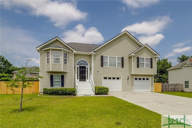 133 Ridgewood Cir, Rincon, GA 31326 - raised ranch with a garage, fence, a front yard, and concrete driveway
