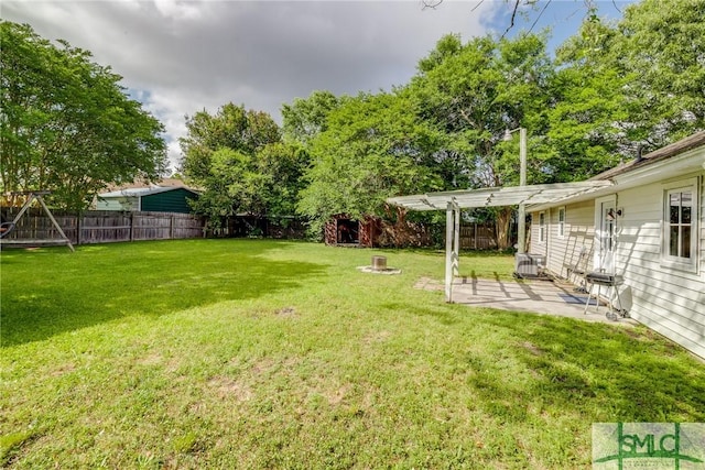 view of yard featuring a patio, central AC, and a fenced backyard