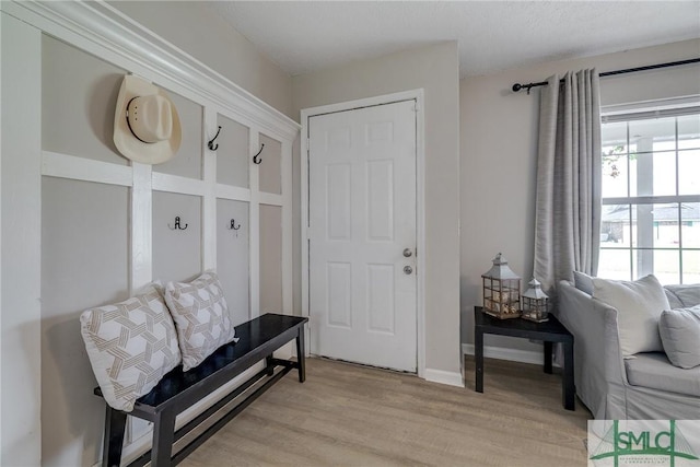 mudroom with light wood finished floors