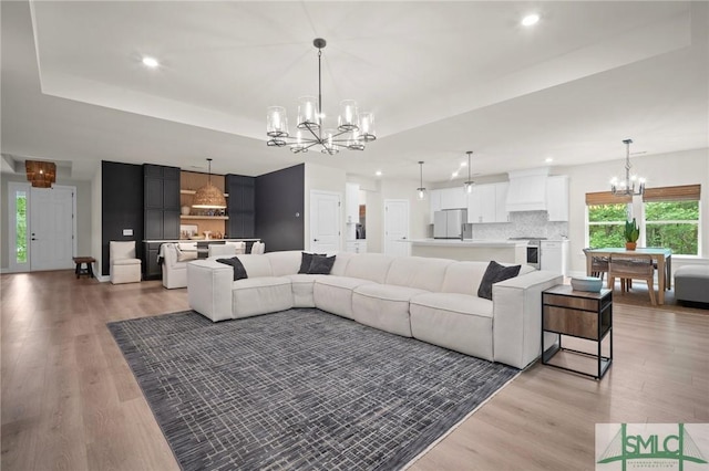 20 Serenity Pt, Savannah, GA 31419 - living area with an inviting chandelier, a wealth of natural light, and light wood-type flooring