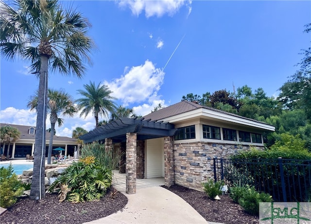 20 Serenity Pt, Savannah, GA 31419 - view of front of property with a pergola, fence, and stone siding
