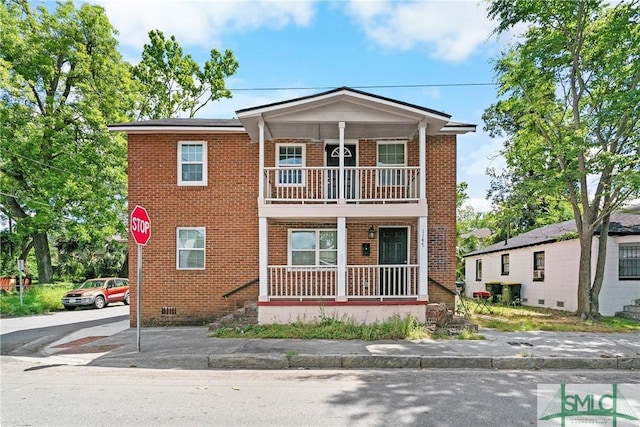 1145 Graydon St, Savannah, GA 31404 - view of front of home featuring a balcony, a porch, and brick siding