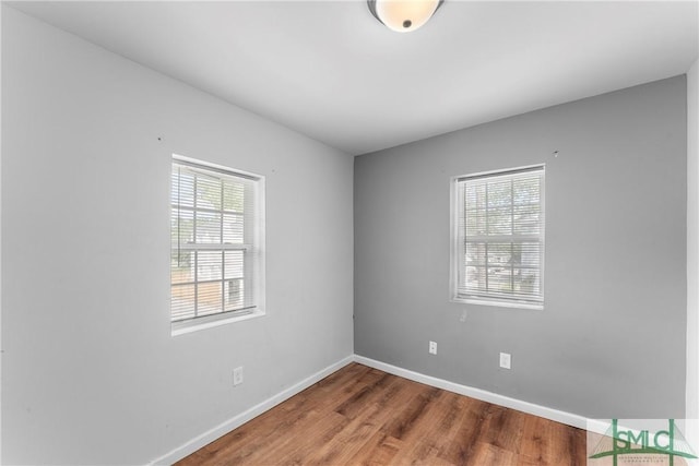 1145 Graydon St, Savannah, GA 31404 - empty room with baseboards, plenty of natural light, and wood finished floors