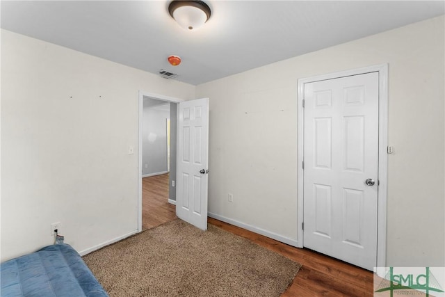 1145 Graydon St, Savannah, GA 31404 - unfurnished bedroom with visible vents, baseboards, and wood finished floors