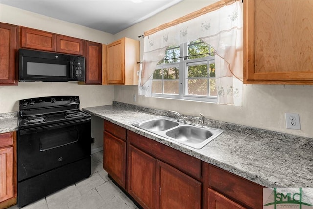 1145 Graydon St, Savannah, GA 31404 - kitchen featuring a sink, light countertops, black appliances, and light tile patterned flooring