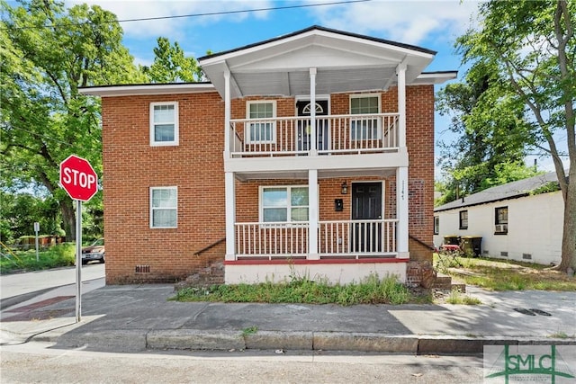 1145 Graydon St, Savannah, GA 31404 - view of front of house featuring a porch, brick siding, crawl space, and a balcony