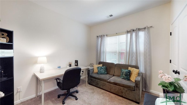 office featuring baseboards, carpet, and visible vents