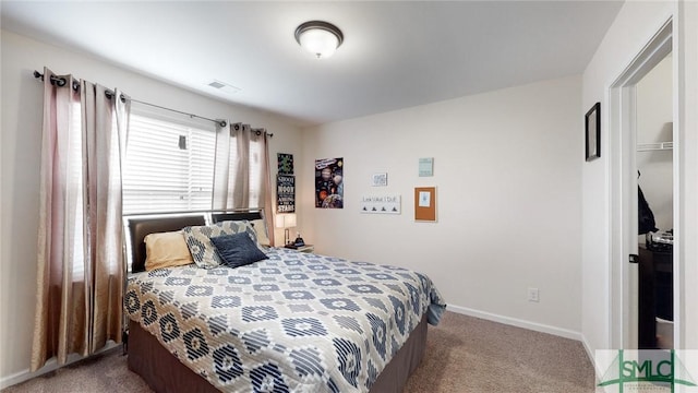 bedroom featuring carpet floors, baseboards, and visible vents