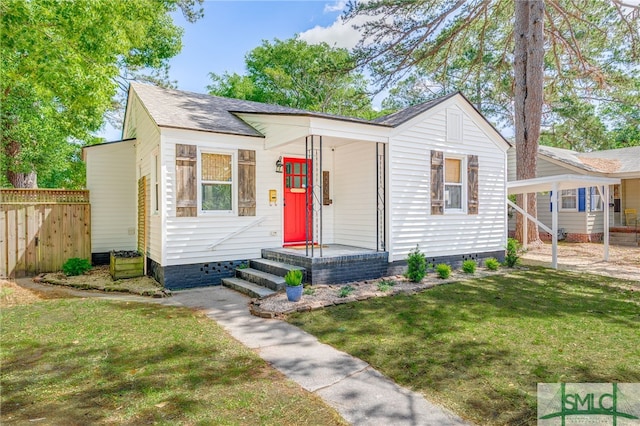 bungalow with fence, a shingled roof, a front lawn, and crawl space