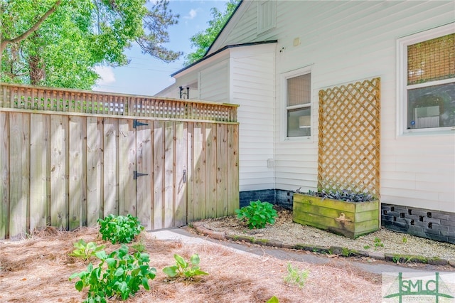 view of home's exterior with fence