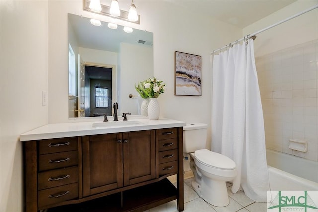 bathroom with visible vents, vanity, shower / bath combination with curtain, toilet, and tile patterned floors