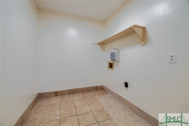 washroom featuring washer hookup, baseboards, and laundry area