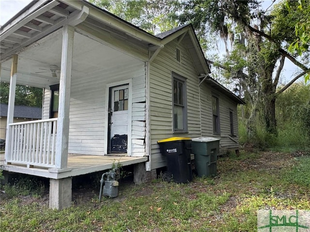 view of property exterior featuring a porch