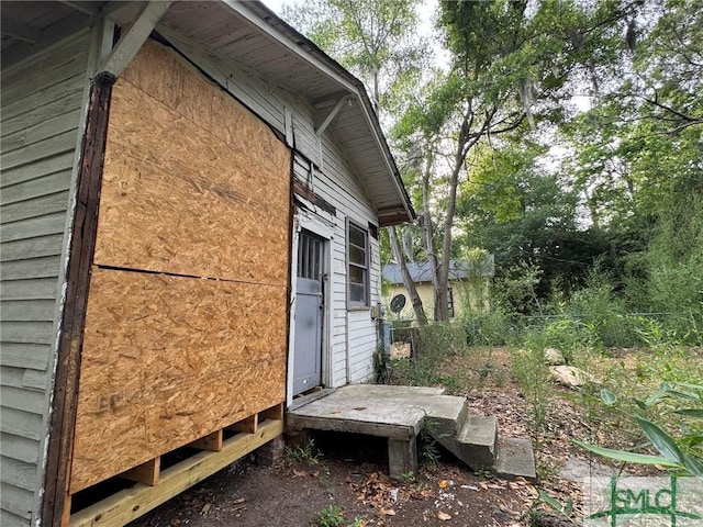 view of property exterior featuring fence
