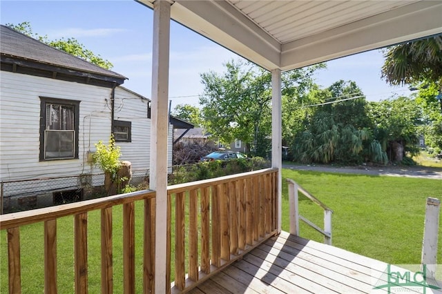 deck featuring a lawn
