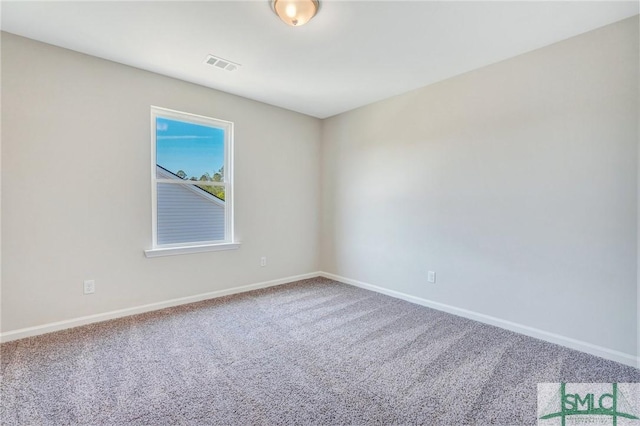 unfurnished room featuring visible vents, carpet flooring, and baseboards