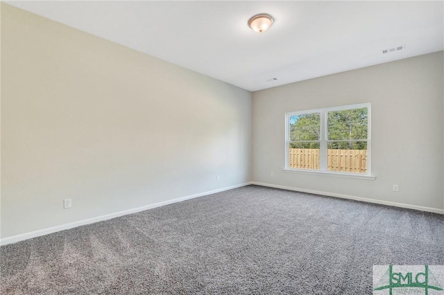 unfurnished room with carpet flooring, baseboards, and visible vents