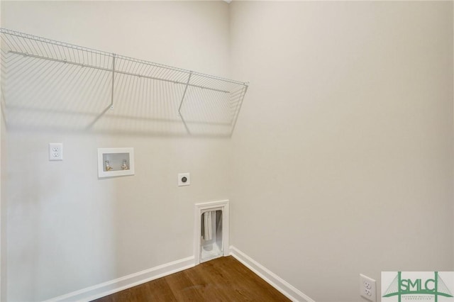 clothes washing area with laundry area, dark wood-style flooring, baseboards, hookup for a washing machine, and hookup for an electric dryer